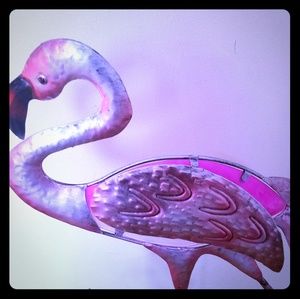 A metal flamingo figurine